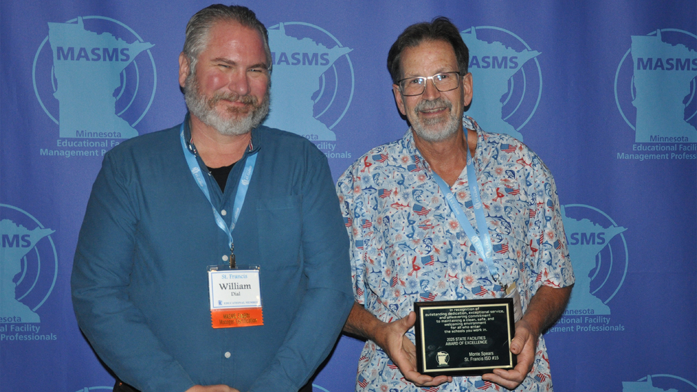William Dial and Monte Spears with award