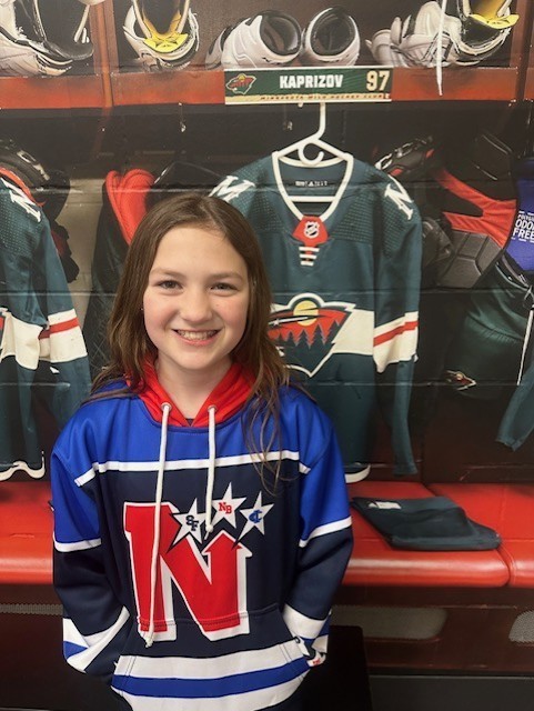 Ashlynn in the MN Wild locker room