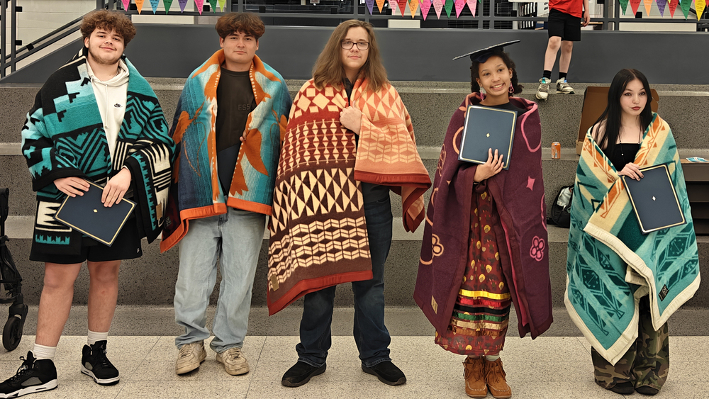 5 students with blankets