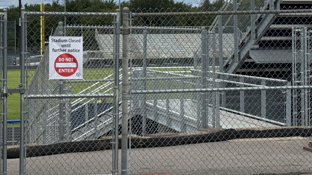 fence with stadium closed sign