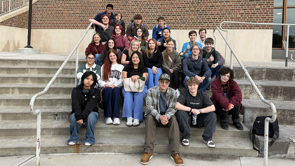 SFHS Media students posing for a photo on stairs