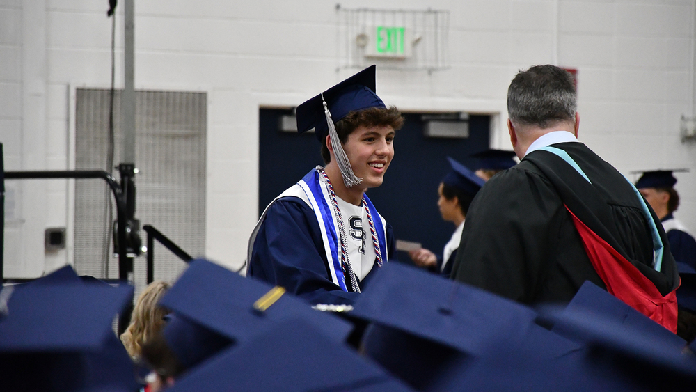 graduate shaking hands with principal 
