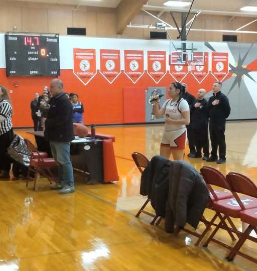 Girls Basketball Game Ymaris Rodriguez sings National Anthem