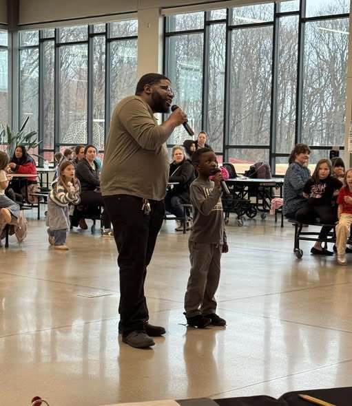 Adult and kid singing at Kids Karaoke Night