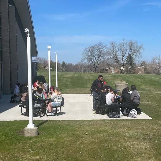 SFHS Students on patio during lunch on a warm day