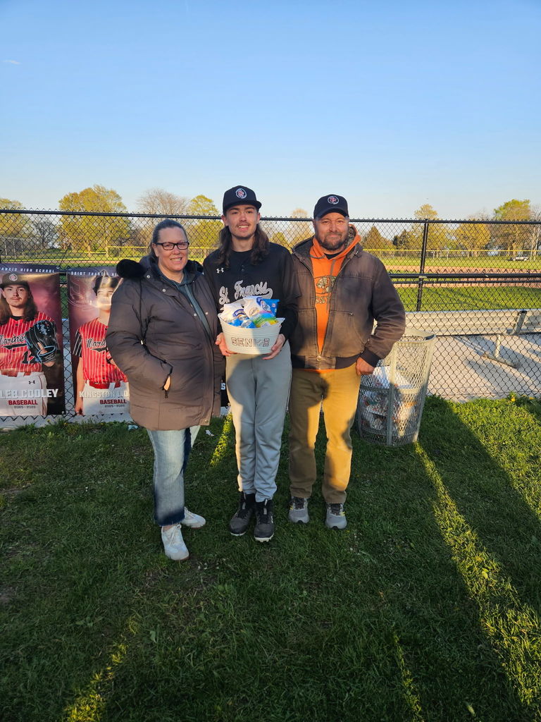 Senior Night baseball with a senior and his parents behind the bench