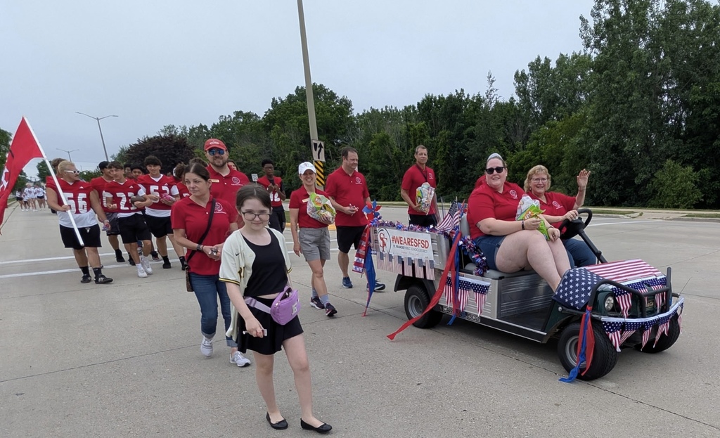 St. Francis parade. Everyone is wearing red.