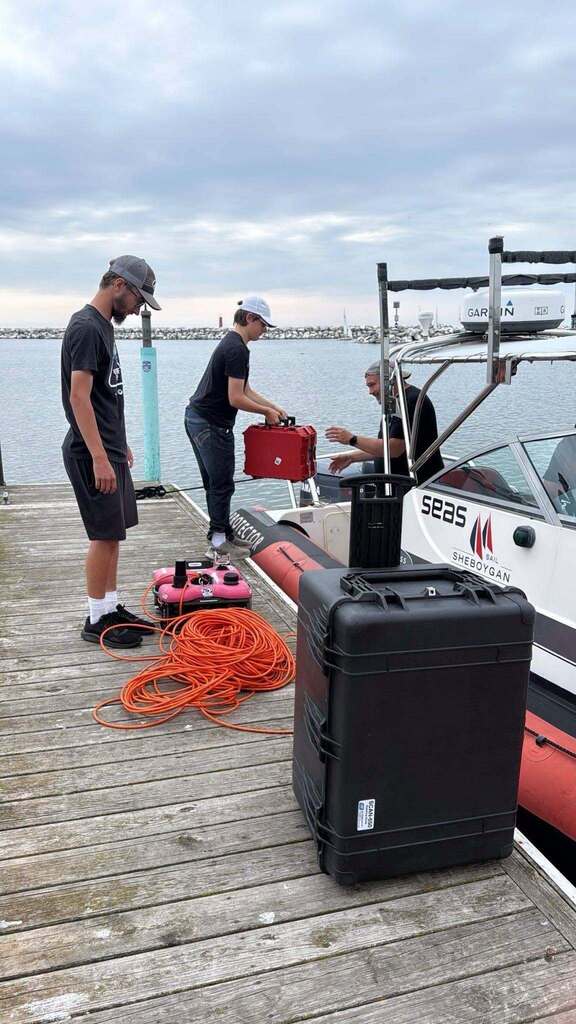 People on dock loading boat