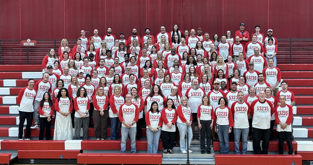 Staff wearing T-shirts that say 53235
