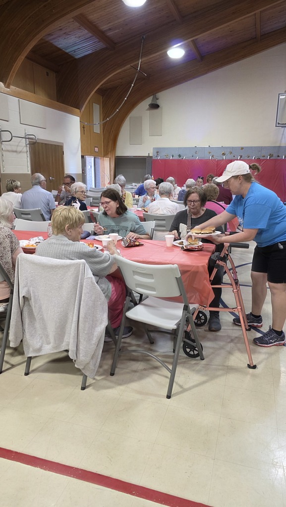 volunteer helping at tables