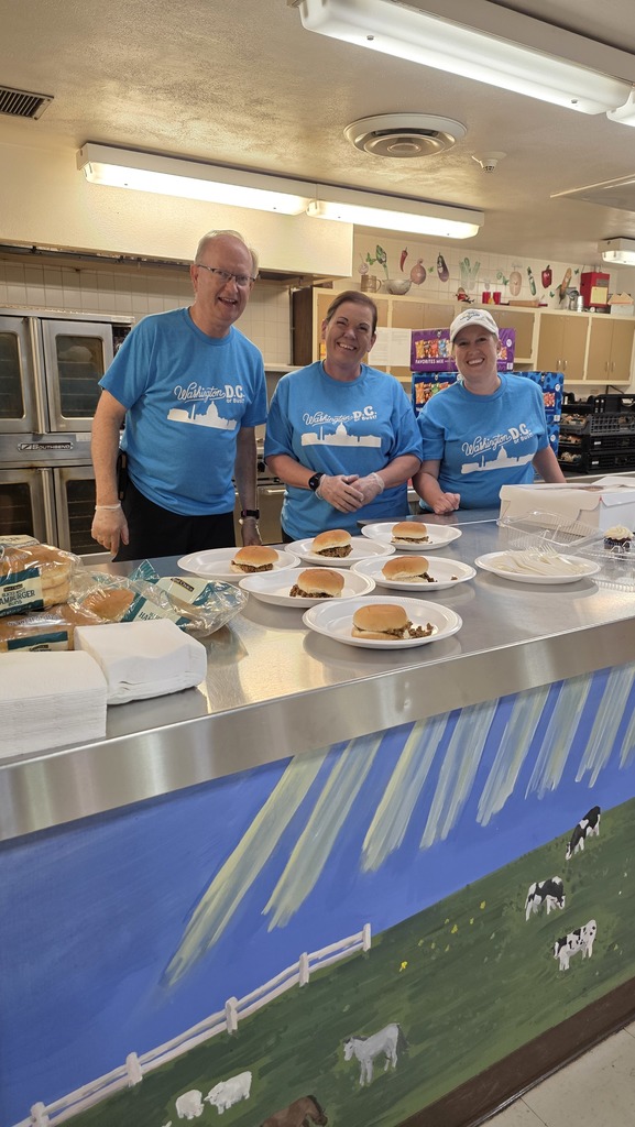 volunteers serving meal