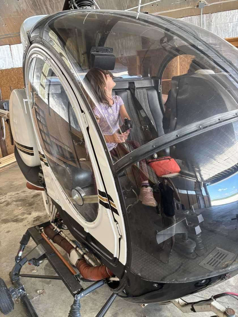 Child sitting in helicopter