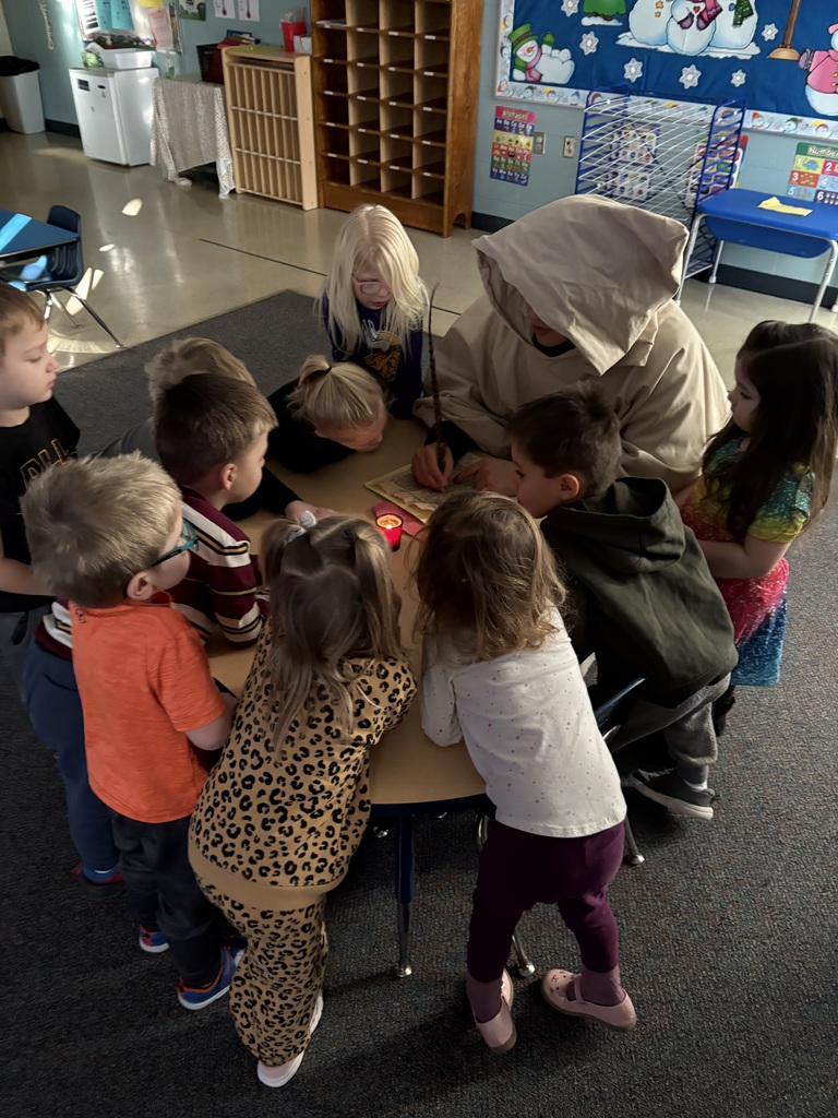 St. Francis writing on his scroll