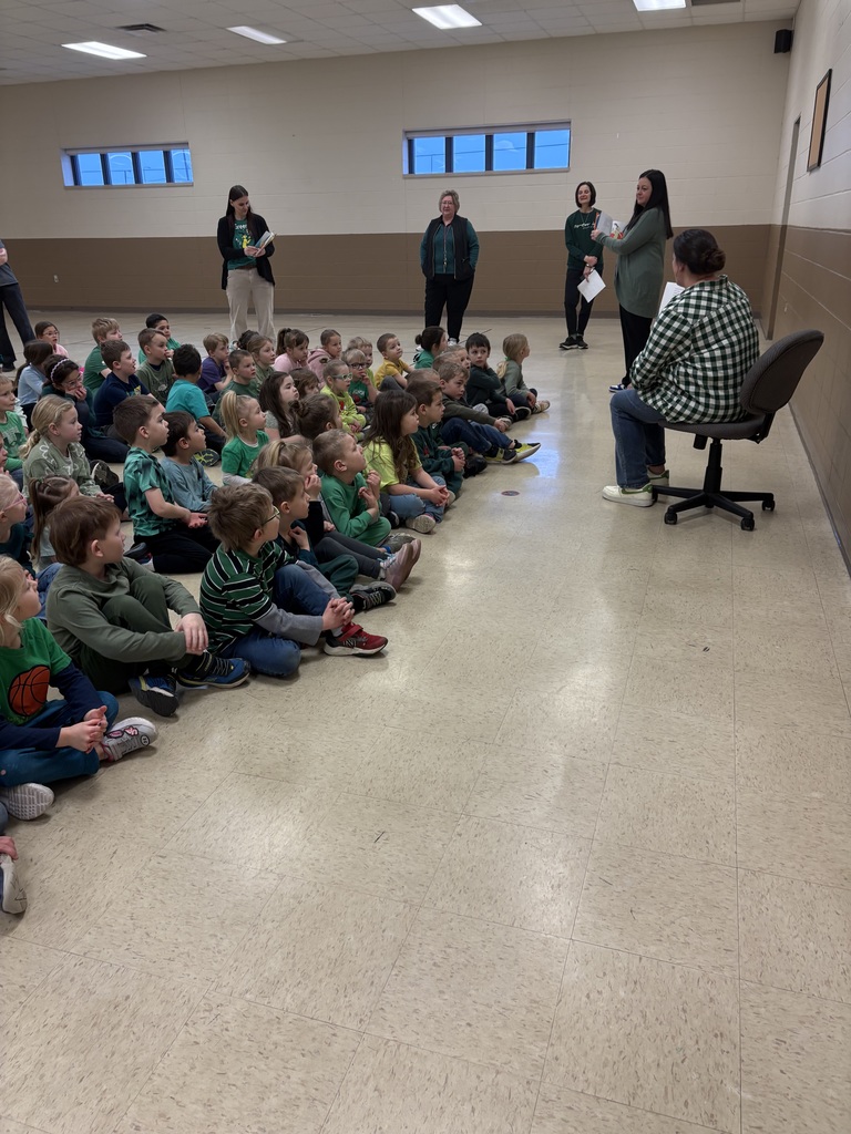 Mrs Hostler reads to the students