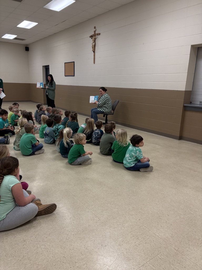 Mrs Hostler reads to the students