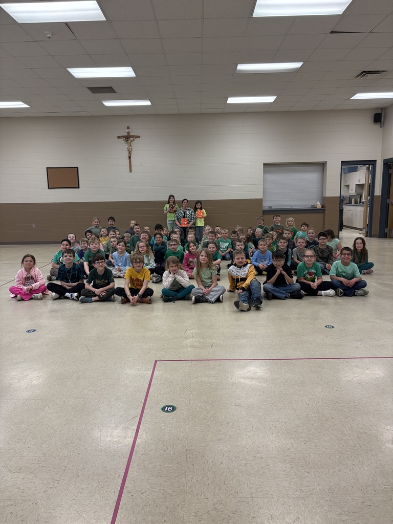 Mrs Hostler reads to the students