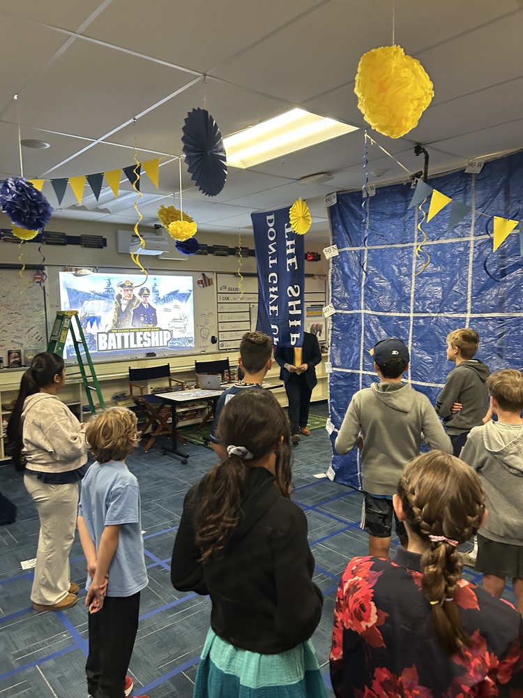 Mr.Pratley playing human battleship with his students to lean latitude and longitude.