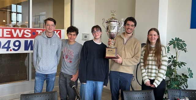 The St. Joseph High School Academic Challenge /Quiz Bowl Team poses with the Championship trophy after beating Our Lady of the Lake to win the WSJM Championship for the second straight year!  