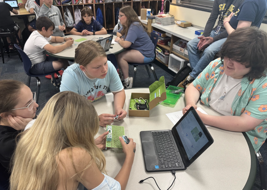 STUDENTS FROM AP ENVIRONMENTAL SCIENCE PARTNER WITH 5TH GRADERS ON A PROJECT SPONSORED BY THE BOSCH CORPORATIION.