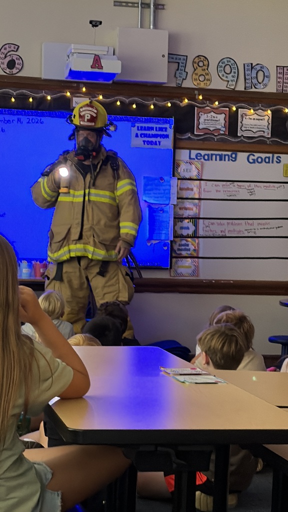 Parent in full firefighting gear at Lincoln Elementary School.