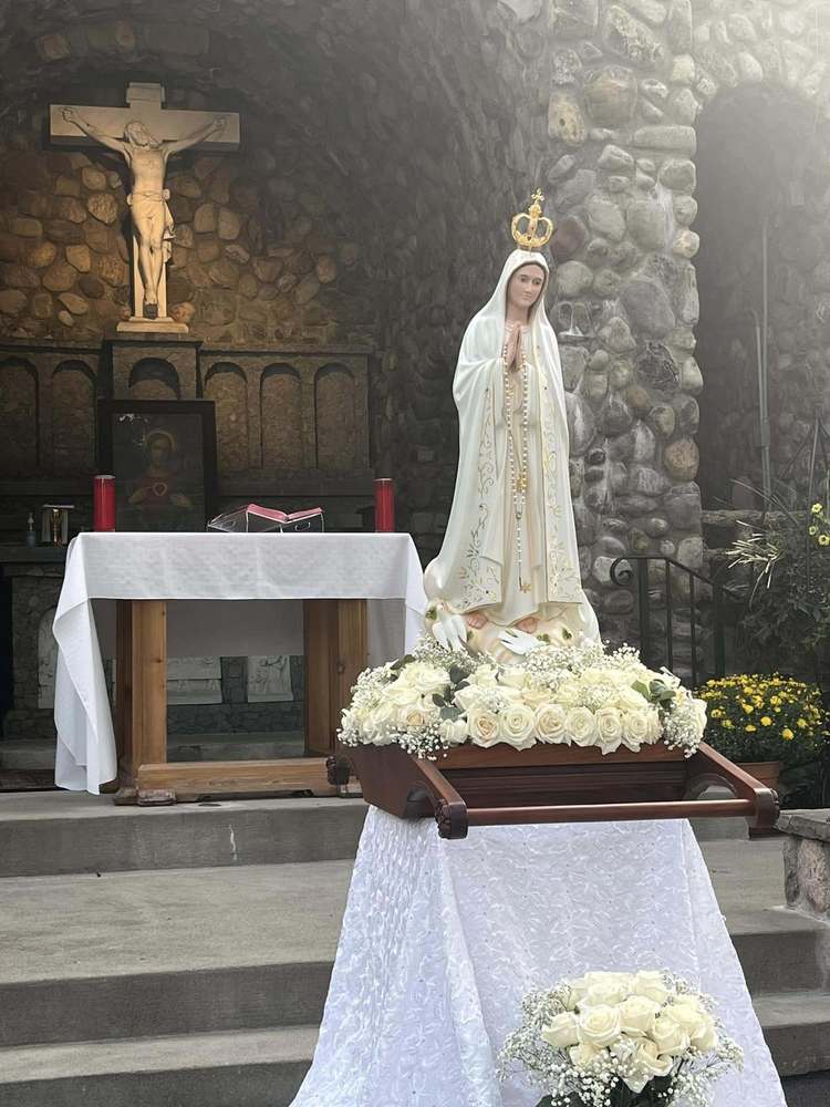 Our Lady of Fatima statue in fron of outdoor altar in Bowmansville
