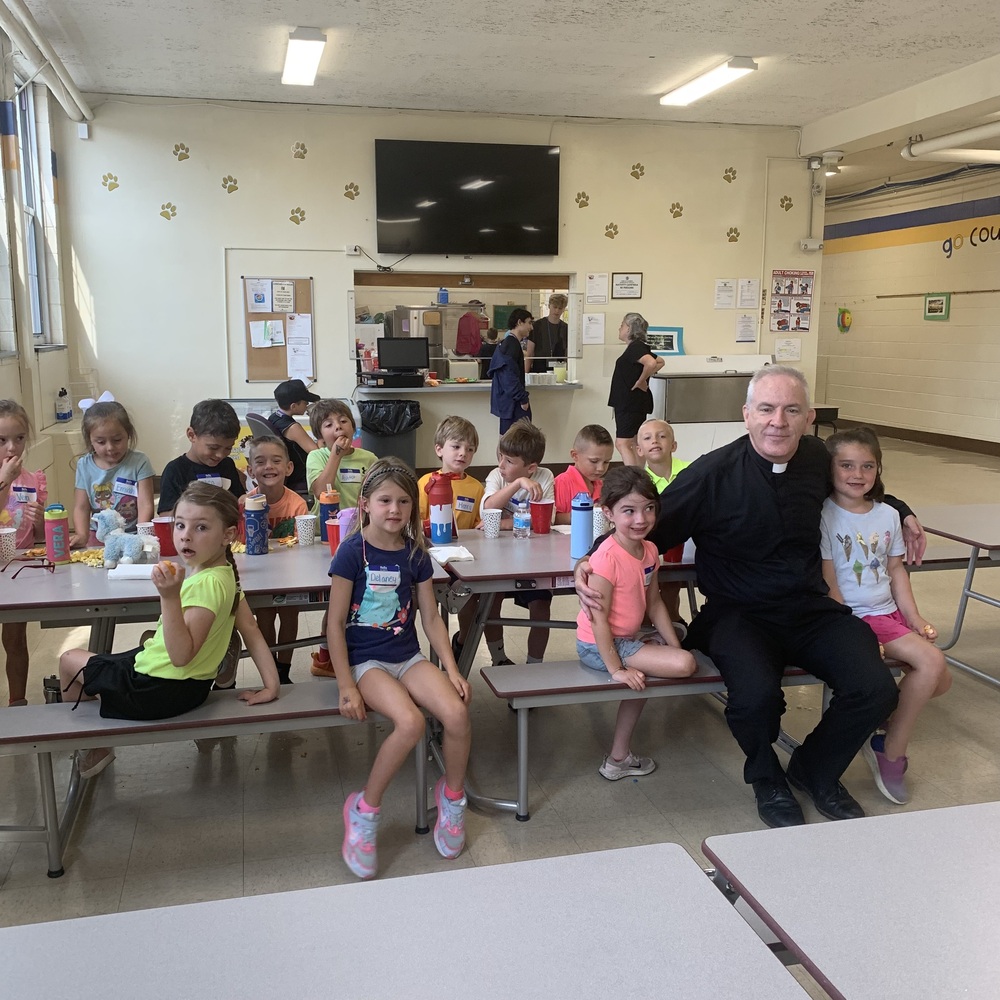 Gathering at tree top treats with Fr. John