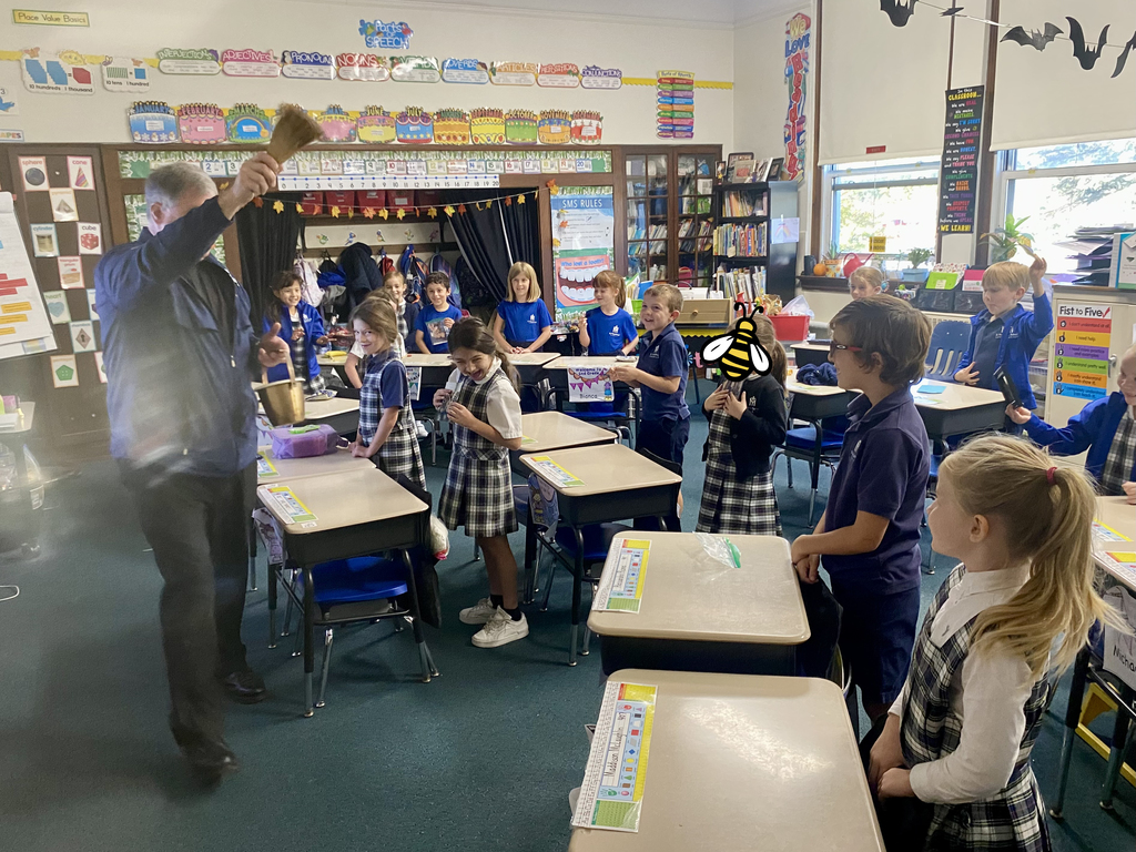 students with stuffed animals and pet photos
