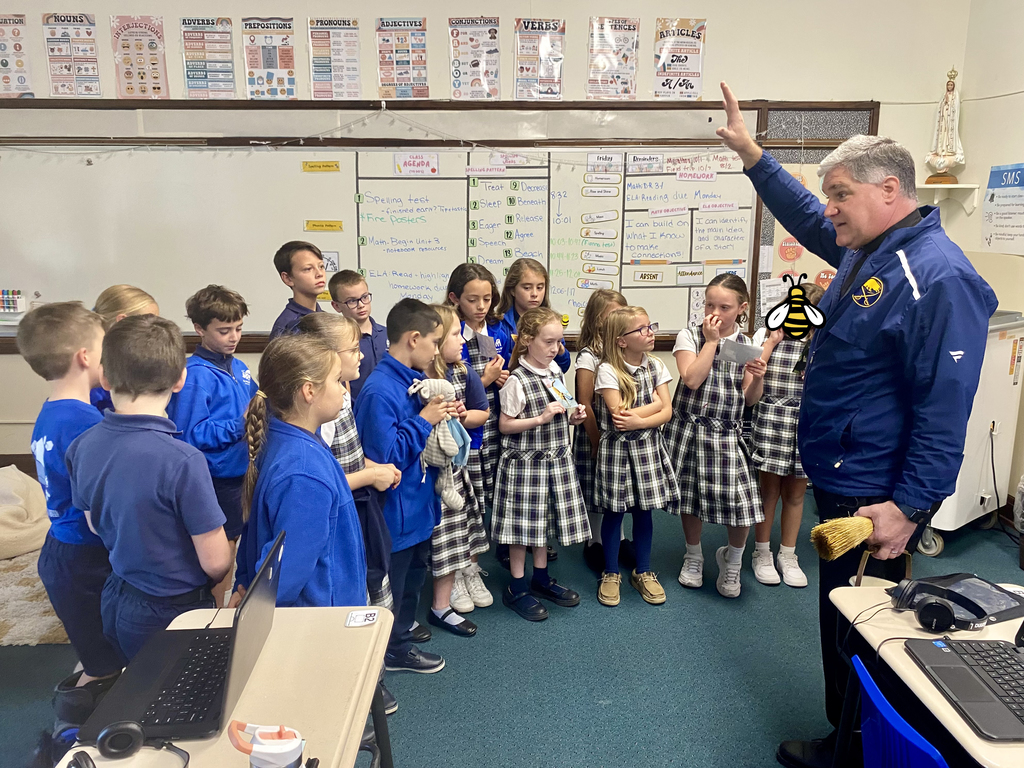 students with stuffed animals and pet photos