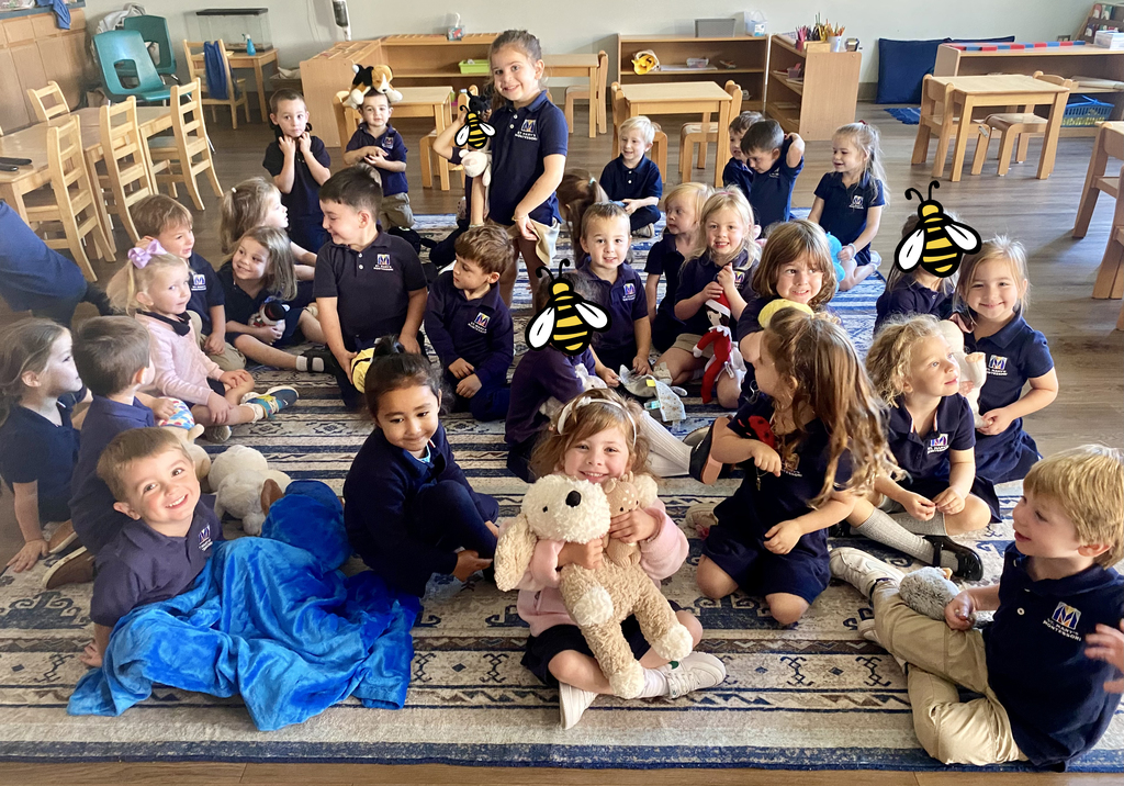 students with stuffed animals and pet photos