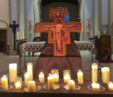 Candles and crucifix at Taize Prayer Service