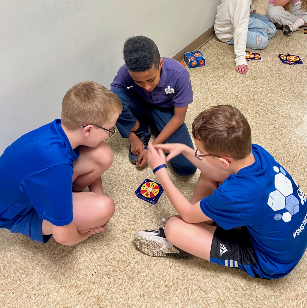 Grade 6 students play a mental math card game