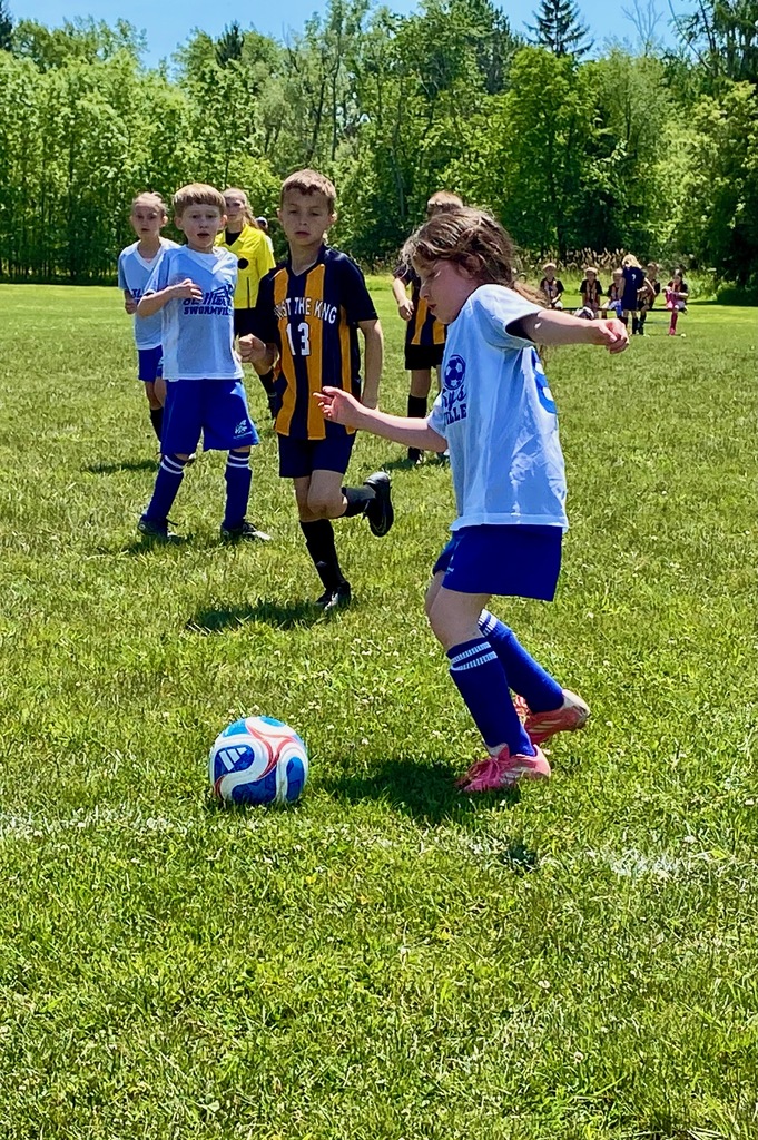 Grades 1 & 2 students playing soccer for St. Mary School Swormville