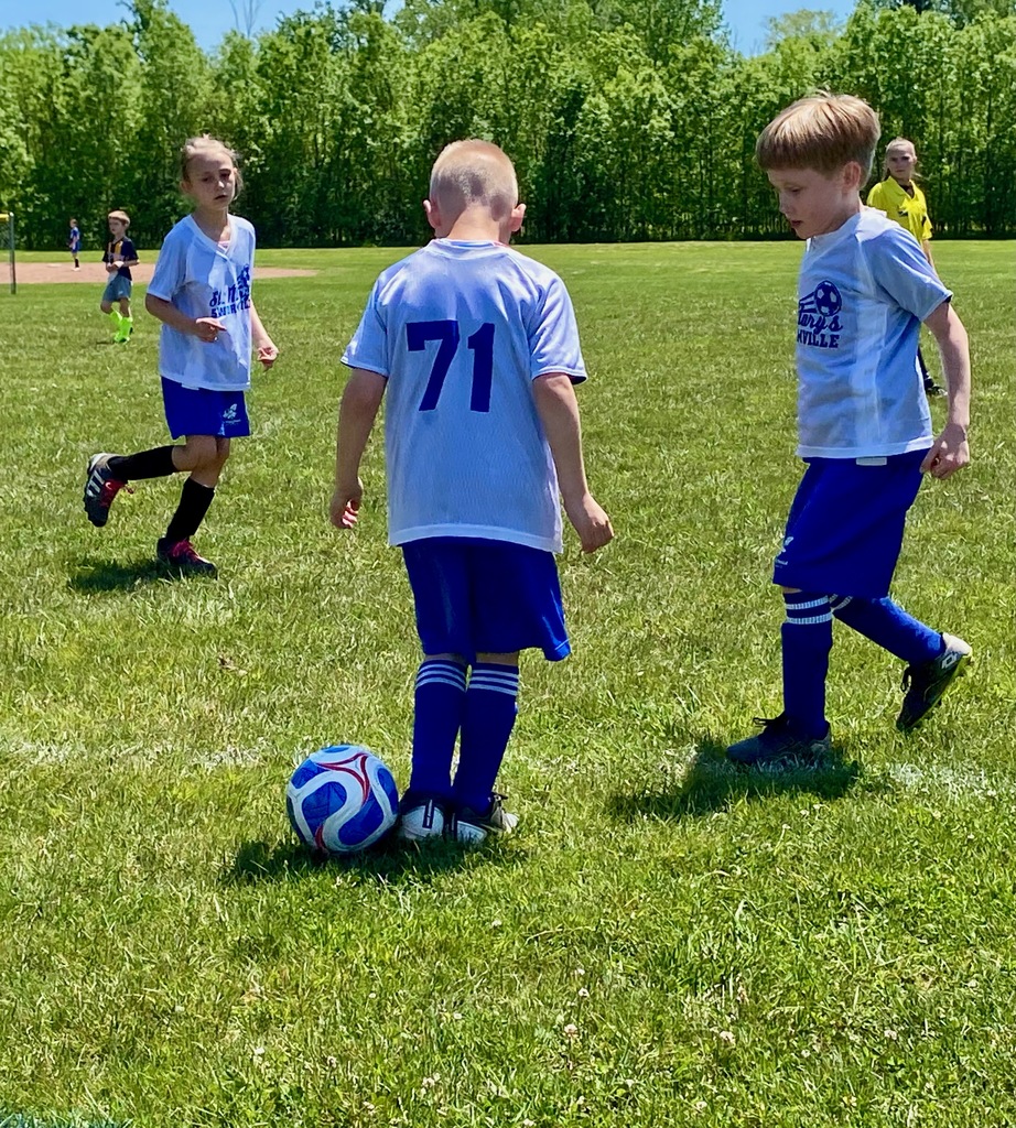 Grades 1 & 2 students playing soccer for St. Mary School Swormville