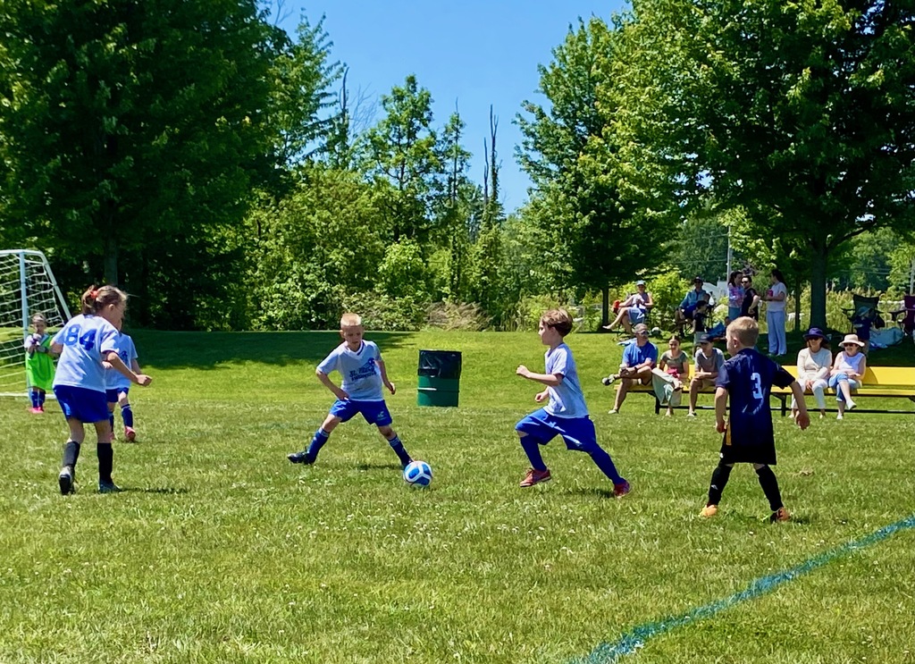 Grades 1 & 2 students playing soccer for St. Mary School Swormville