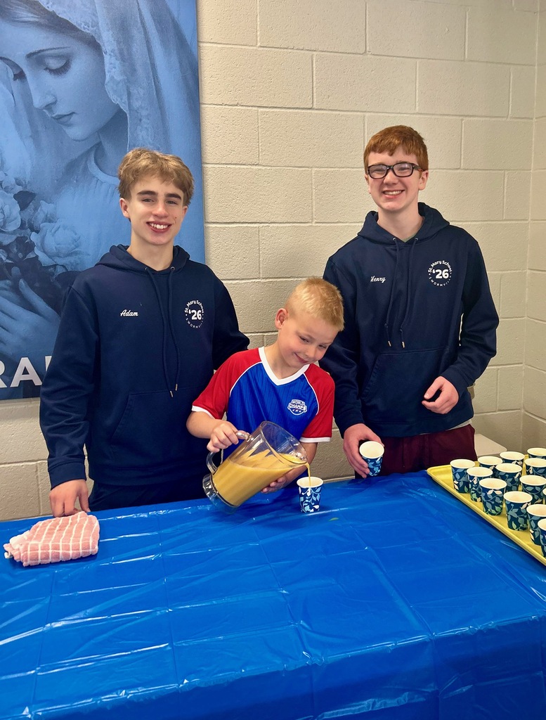 SMS students serve juice at a pancake breakfast