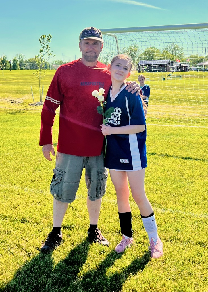 grade 8 soccer player student poses with parents