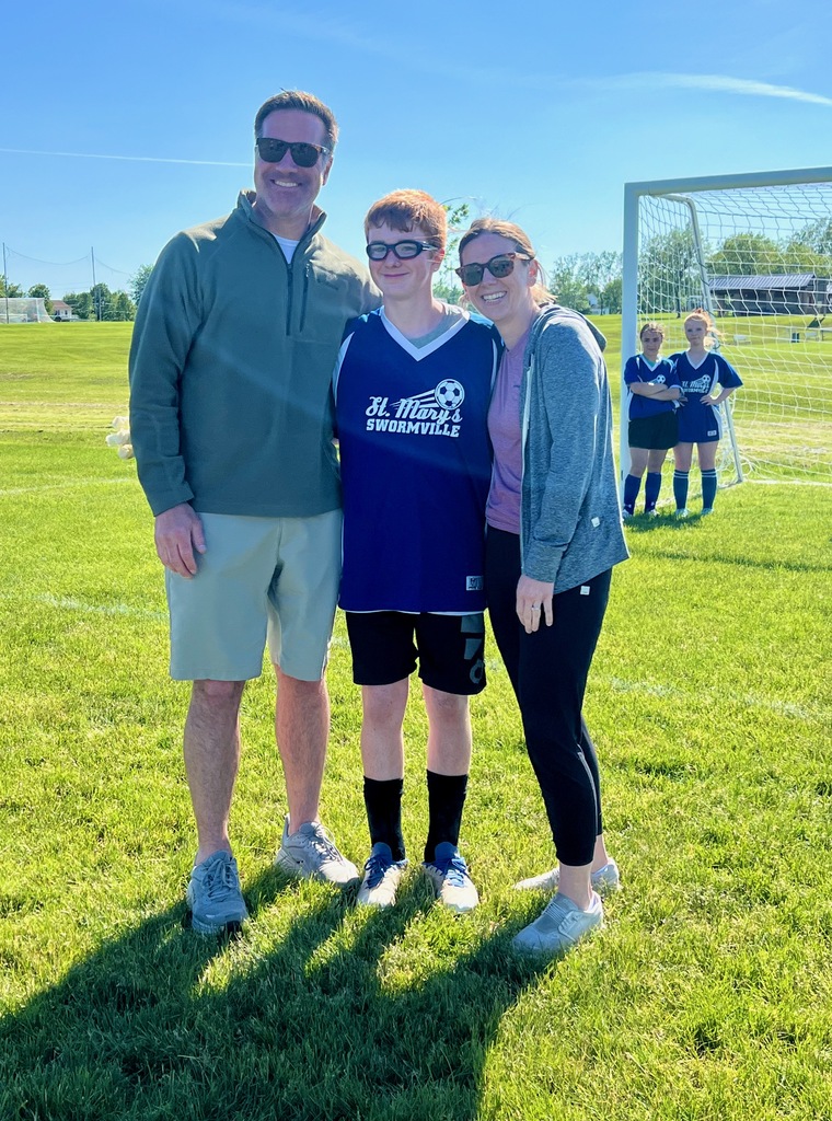 grade 8 soccer player student poses with parents