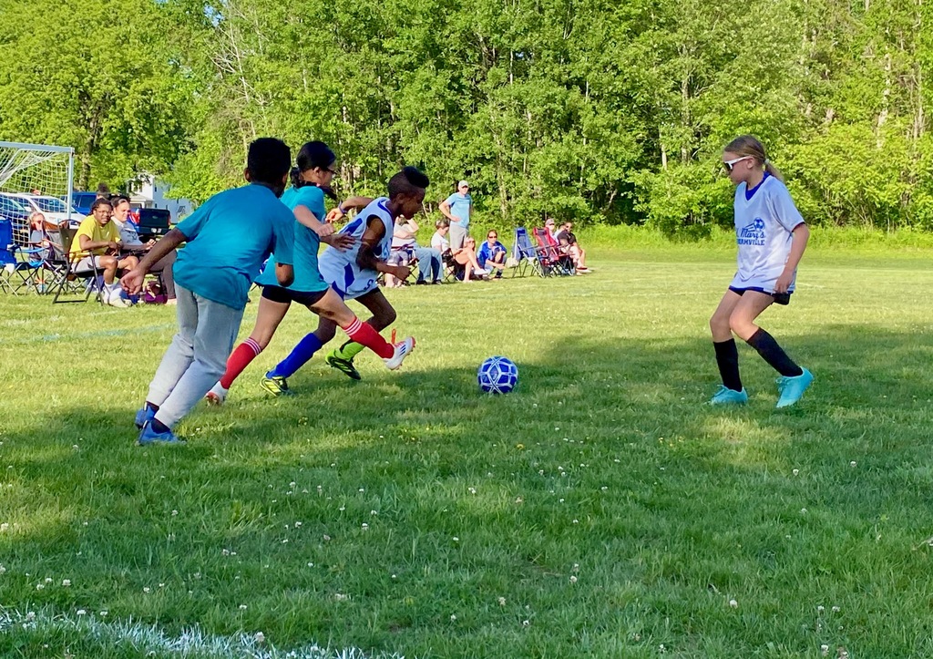 SMS grade 3 & 4 soccer players on the field during their last game of the season