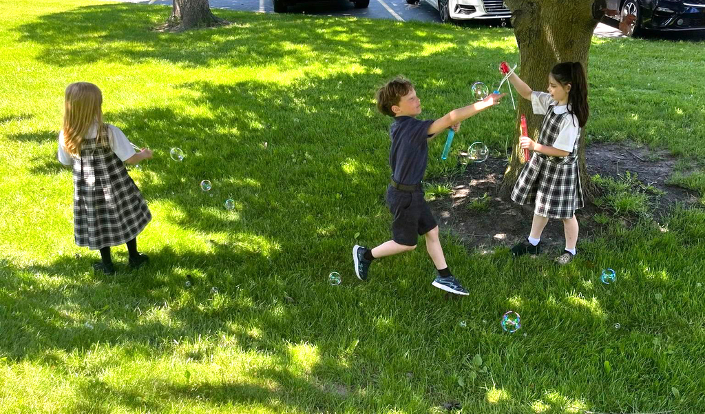 grade 1 students have fun outside with bubble themed lessons