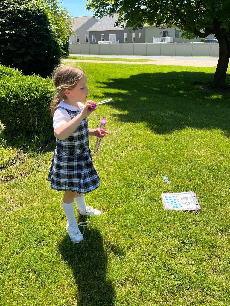 grade 1 students have fun outside with bubble themed lessons