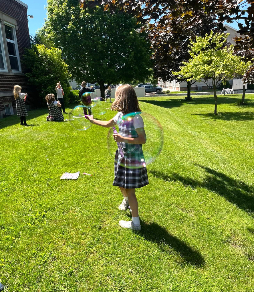 grade 1 students have fun outside with bubble themed lessons