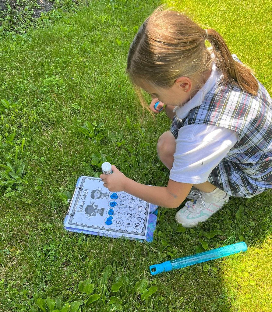 grade 1 students have fun outside with bubble themed lessons