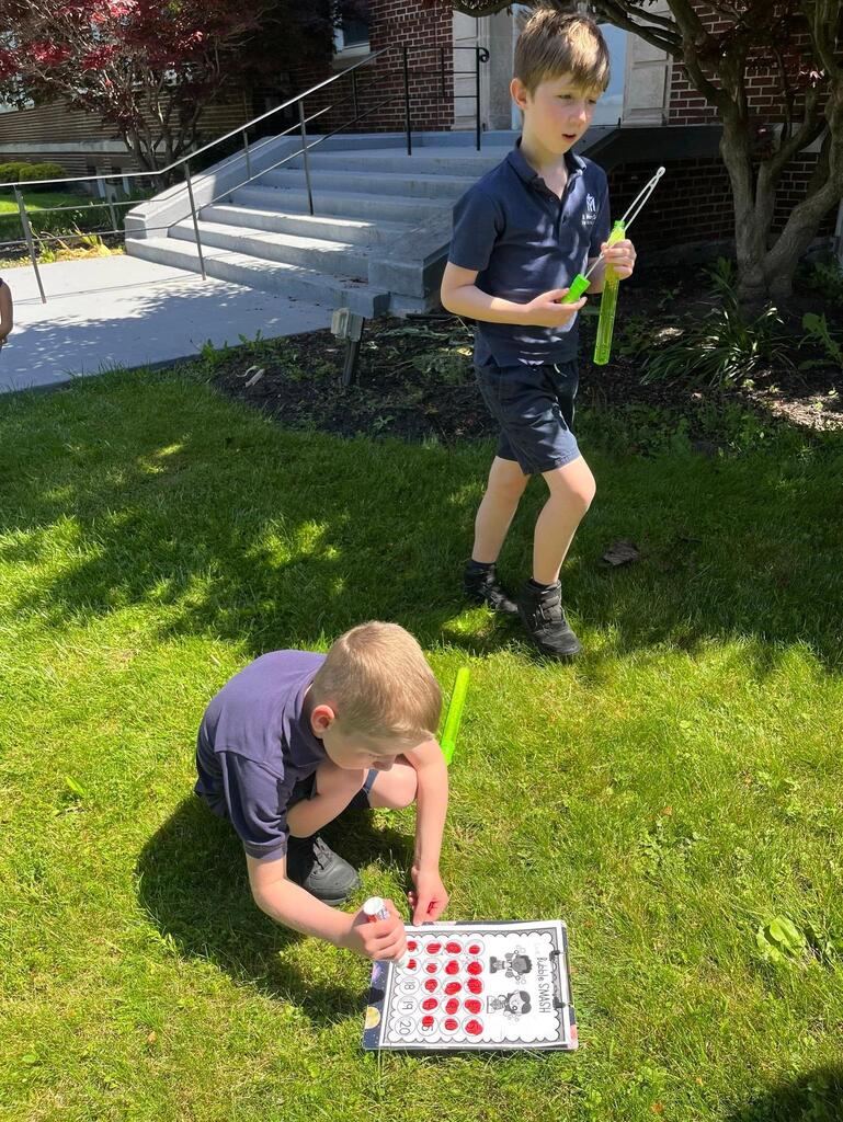 grade 1 students have fun outside with bubble themed lessons