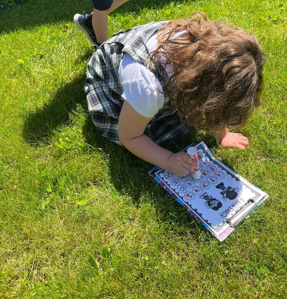 grade 1 students have fun outside with bubble themed lessons