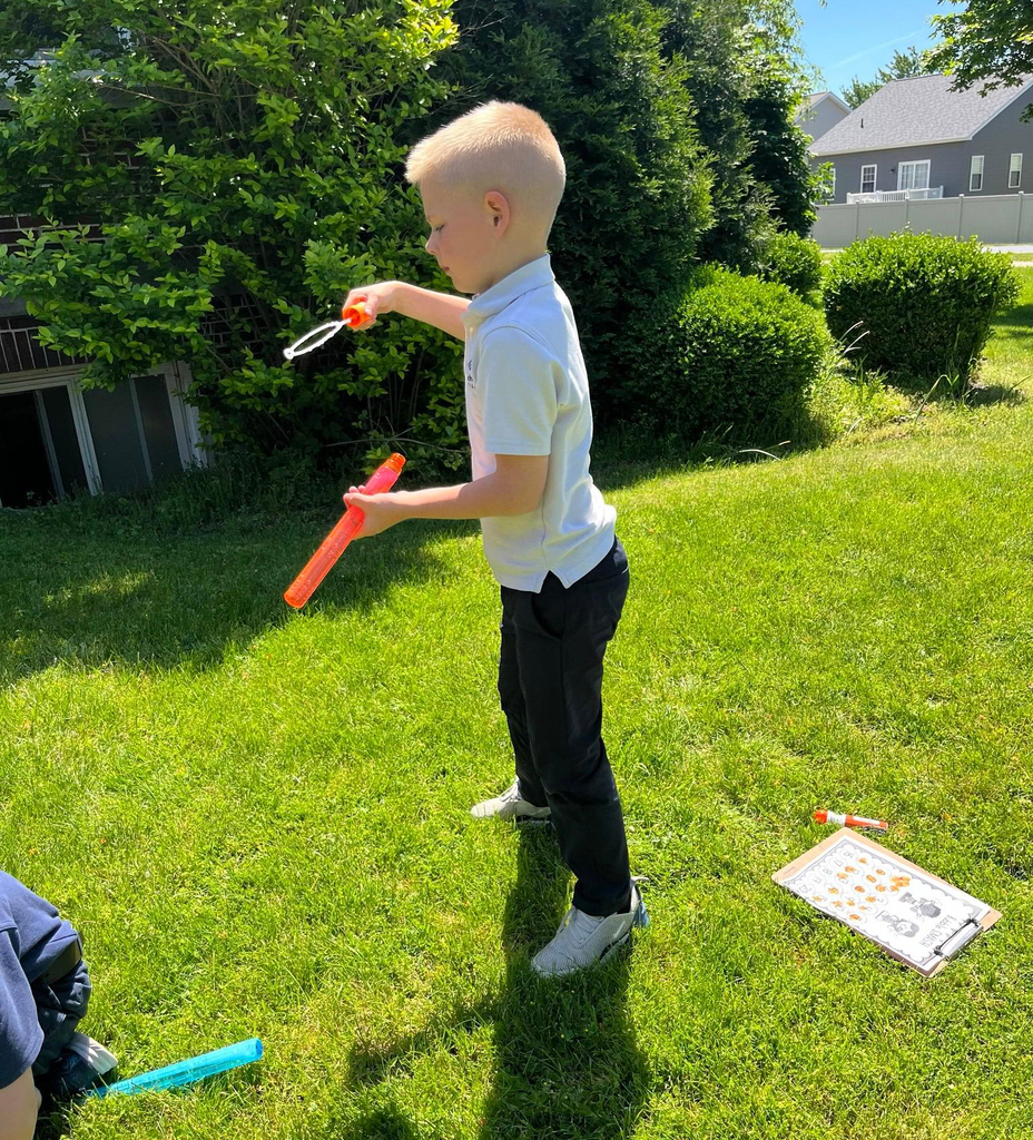 grade 1 students have fun outside with bubble themed lessons
