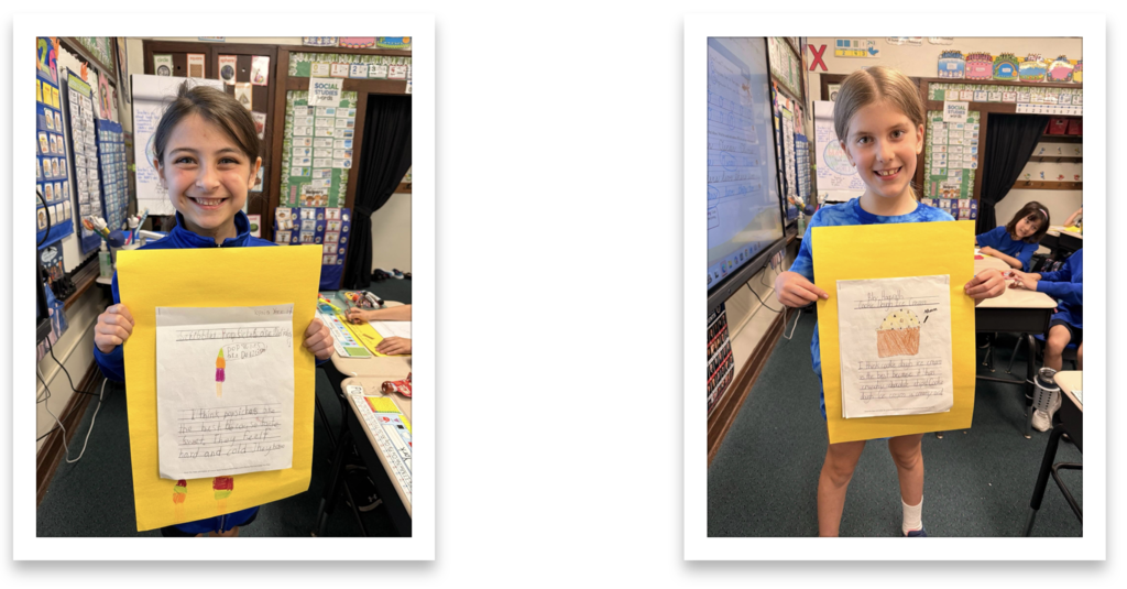 grade 2 students hold up their persuasive writing essays