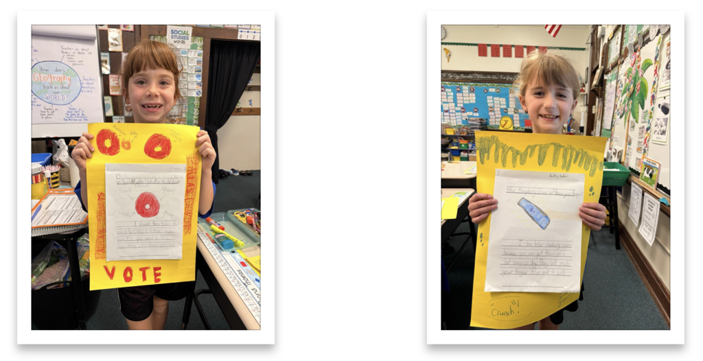grade 2 students hold up their persuasive writing essays