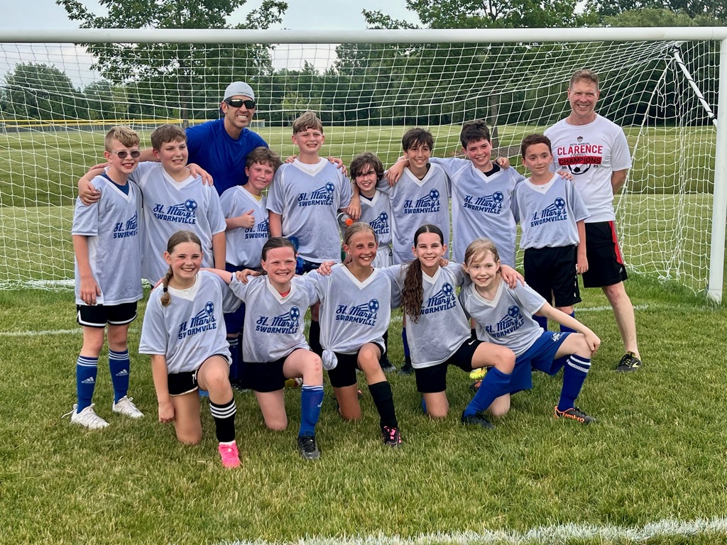 St. Mary School soccer players pose in the net for a team photo