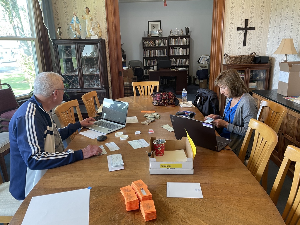 two people recording tickets at St. Mary's