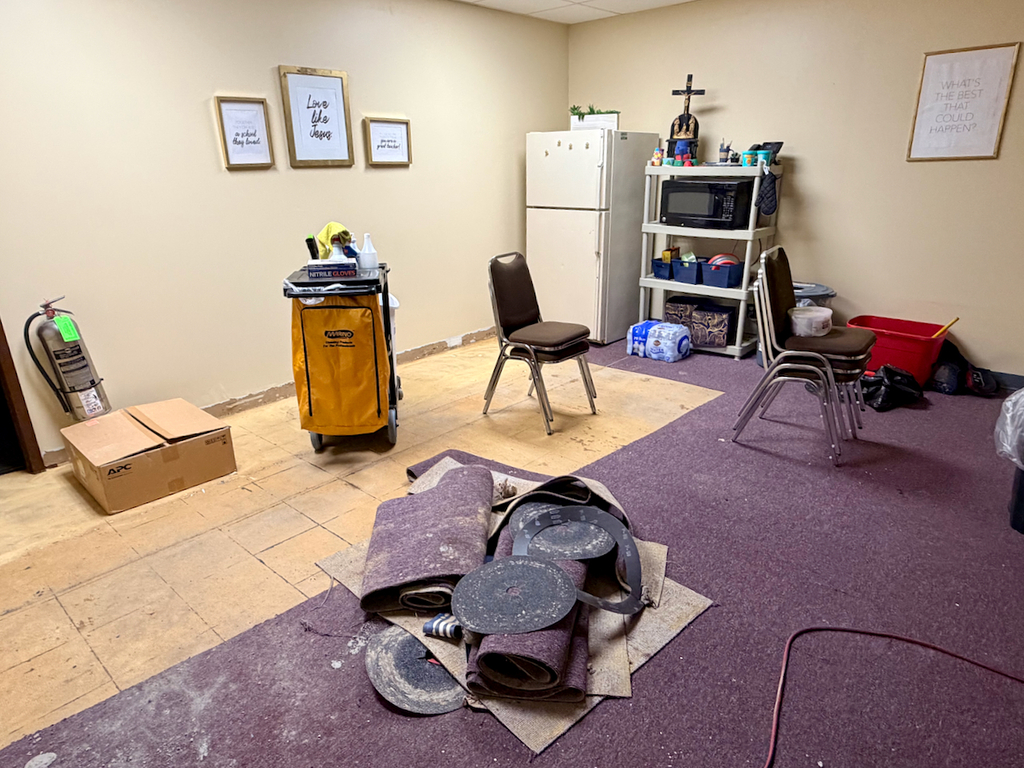 In process photos of the renovation of the school flooring in the basement